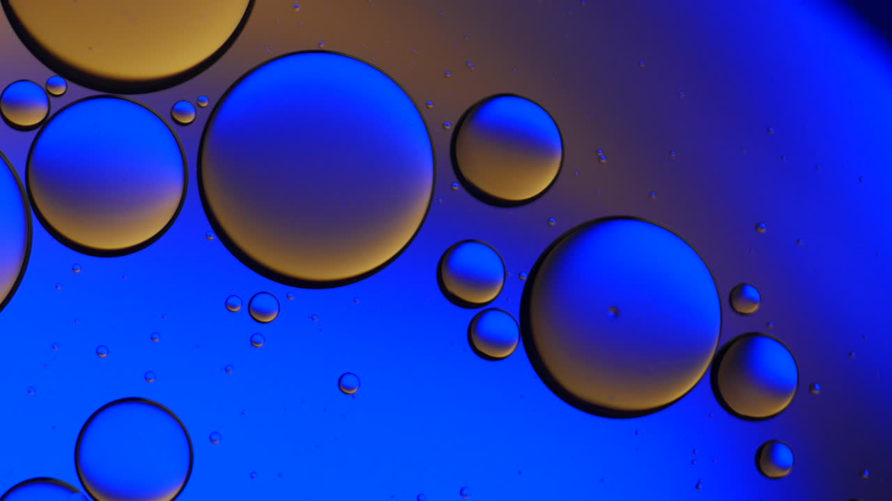 Colorful artistic of oil drop floating on the water.