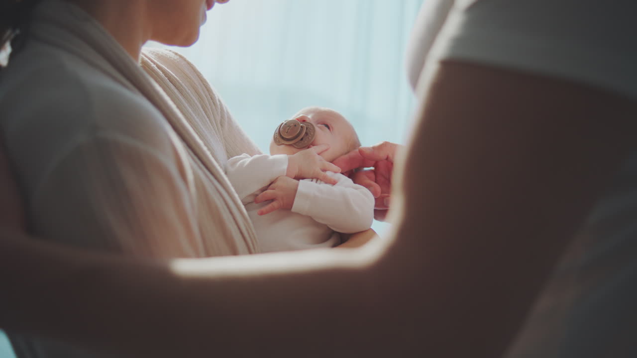 Parents lovingly caring for their newborn baby