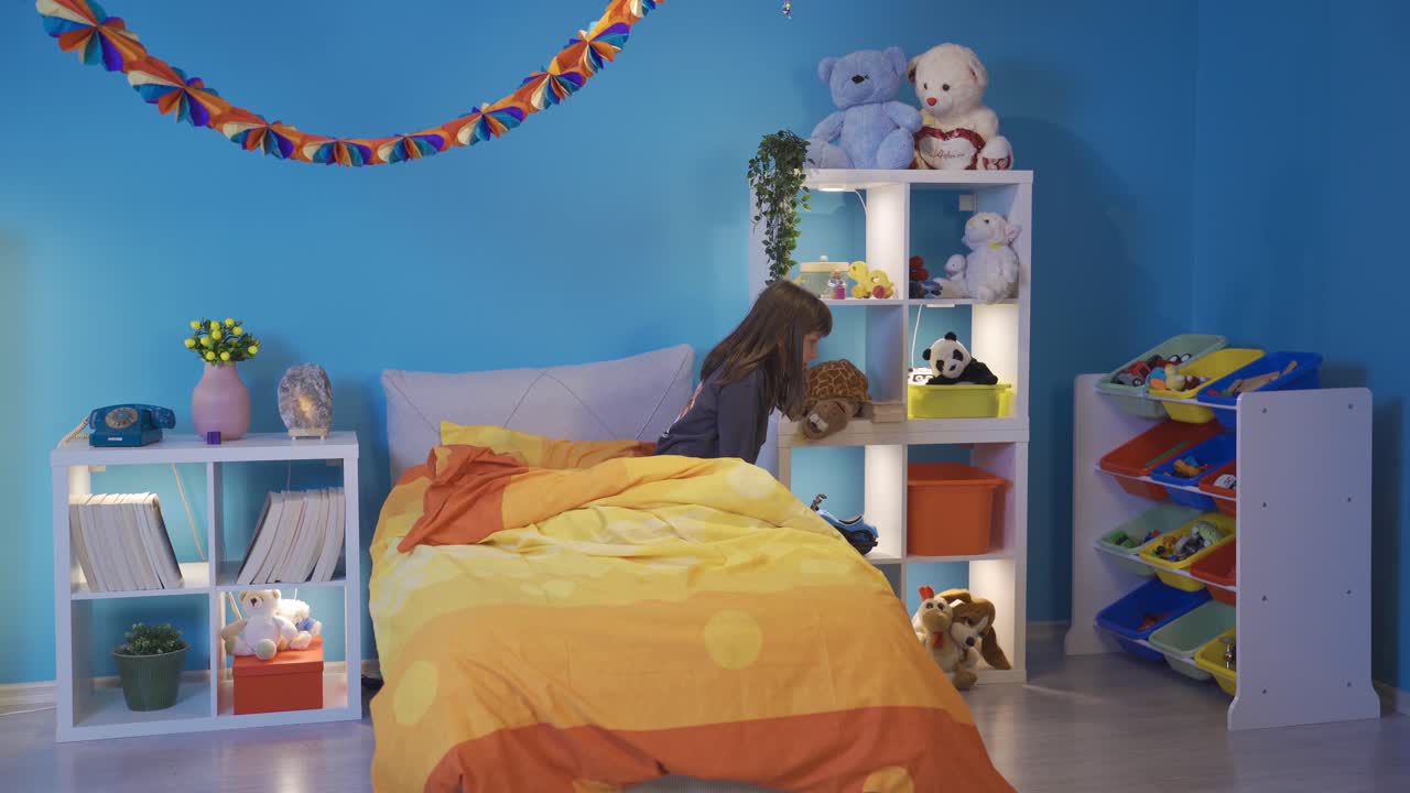 Little girl afraid of the dark looks around the room. Can't sleep alone.