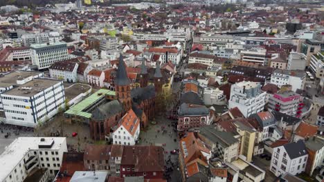 Aerial-drone-view-of-old-city-of-Kaiserslautern,-Germany-while-the-FCK-Kaiserslautern-fans-with-beer