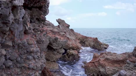Volcanic-rocky-cliffs-hit-by-sea-waves,Serra-D’Irta-natural-park,Spain
