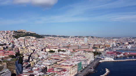 aerial view over naples city and seaport in italy - drone shot