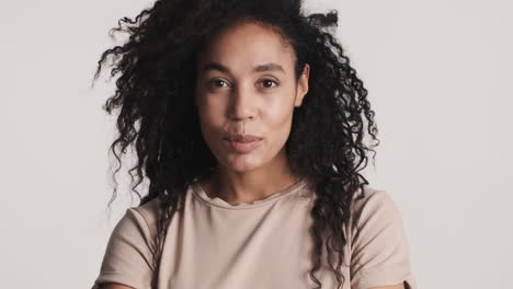 african american confident woman over white background.