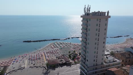 rising aerial on the coastline of porto recanati, piazza brancondi, local italian getaway for the summer on the adriatic sea