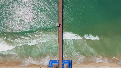 People-Walking-On-San-Clemente-Pier-In-Orange-County,-California