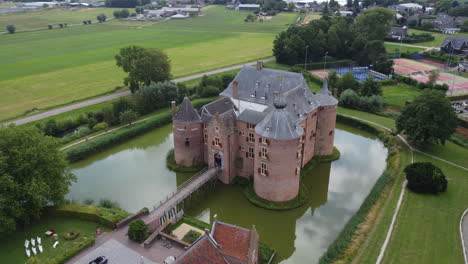 ammersoyen castle: aerial view in orbit of the beautiful castle and the bridge and the moat that surrounds it