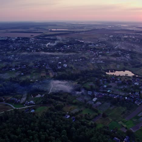 sunrise/sunset over a misty village from above
