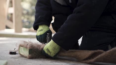 worker installing insulation material