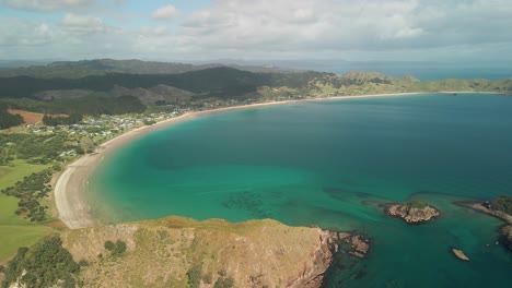 Scenic-drone-flight-high-above-Opito-bay