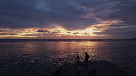 couple watching sunset in seychelles