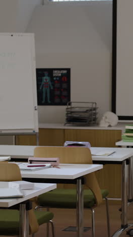 classroom with projector screen and desks