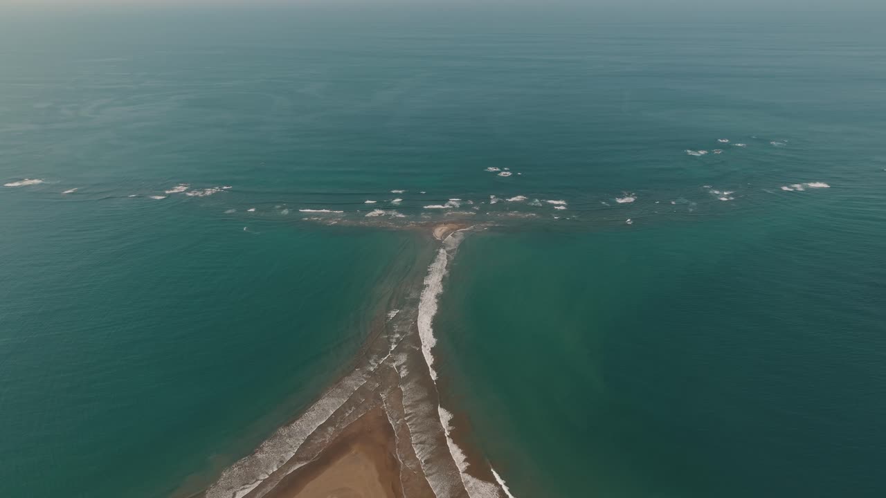 Sea Waves Crashing On Sandbar Of Whale's Tail Beach, Uvita In Costa Rica, Central America