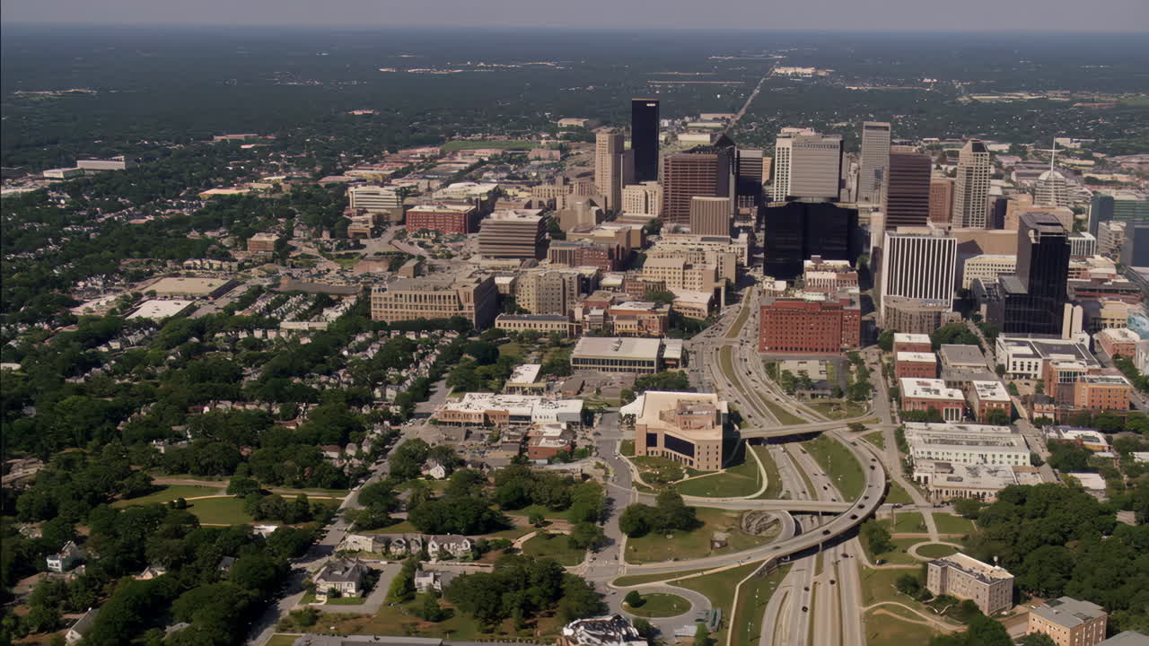 Aerial View of a Bustling City with a Prominent Skyline and Intersecting Highways