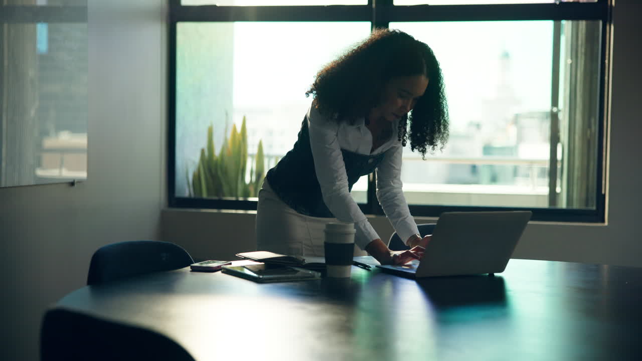 Businesswoman working on laptop in office