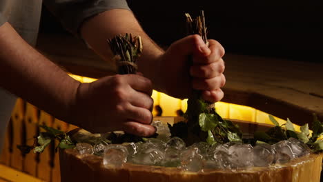 preparing birch brooms for a sauna