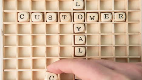 customer care buzz words spelled out in dice and placed on grid