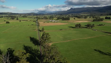 Green-countryside-in-Tasmania,-Australia.-Aerial-drone-ascending