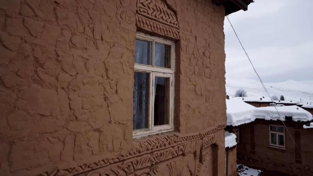 Snowy Adobe Village in the Mountains