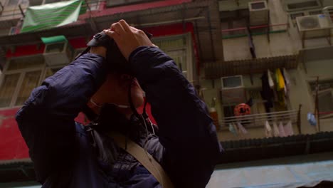 Man-Photographing-Hong-Kong-Tower-Block