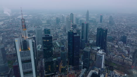 Aerial-footage-of-business-centre-with-high-rise-modern-office-towers.-Hazy-day-in-large-city.-Frankfurt-am-Main,-Germany