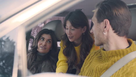 husband and wife sitting in the front seats of a car 4