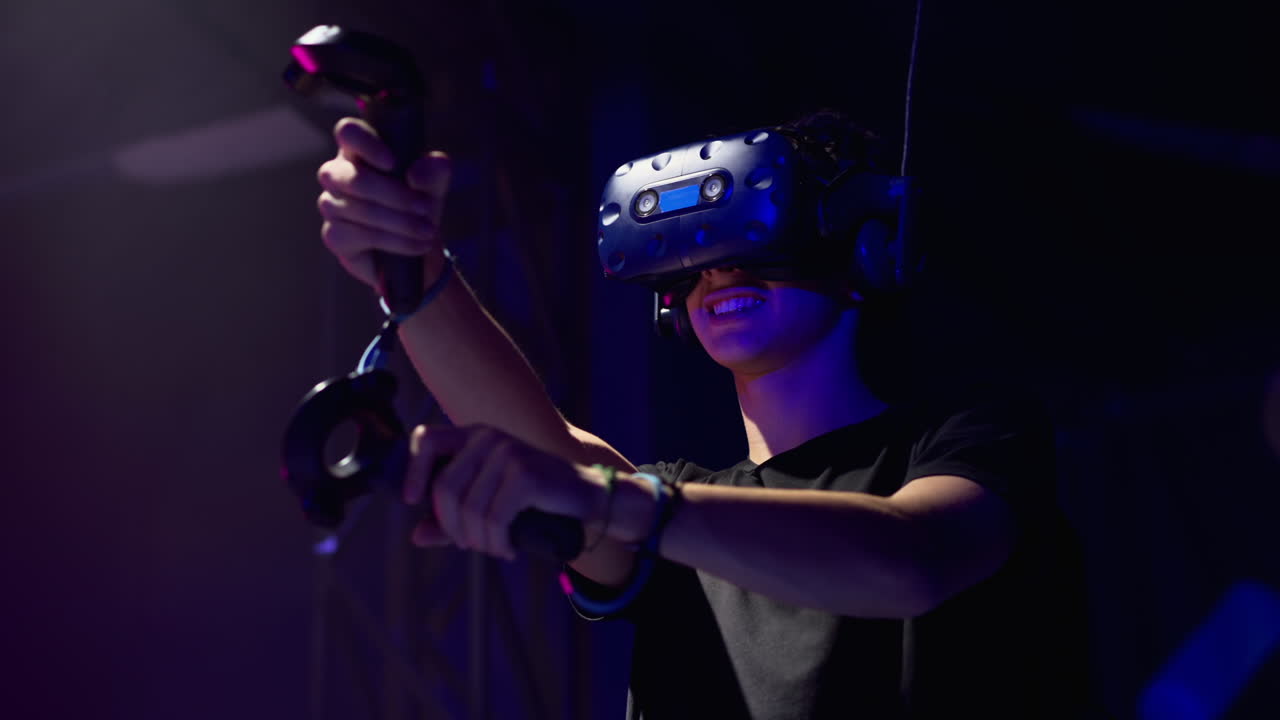Boy playing with a Virtual Reality headset in a studio