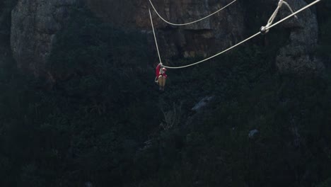 young caucasian man zip lining