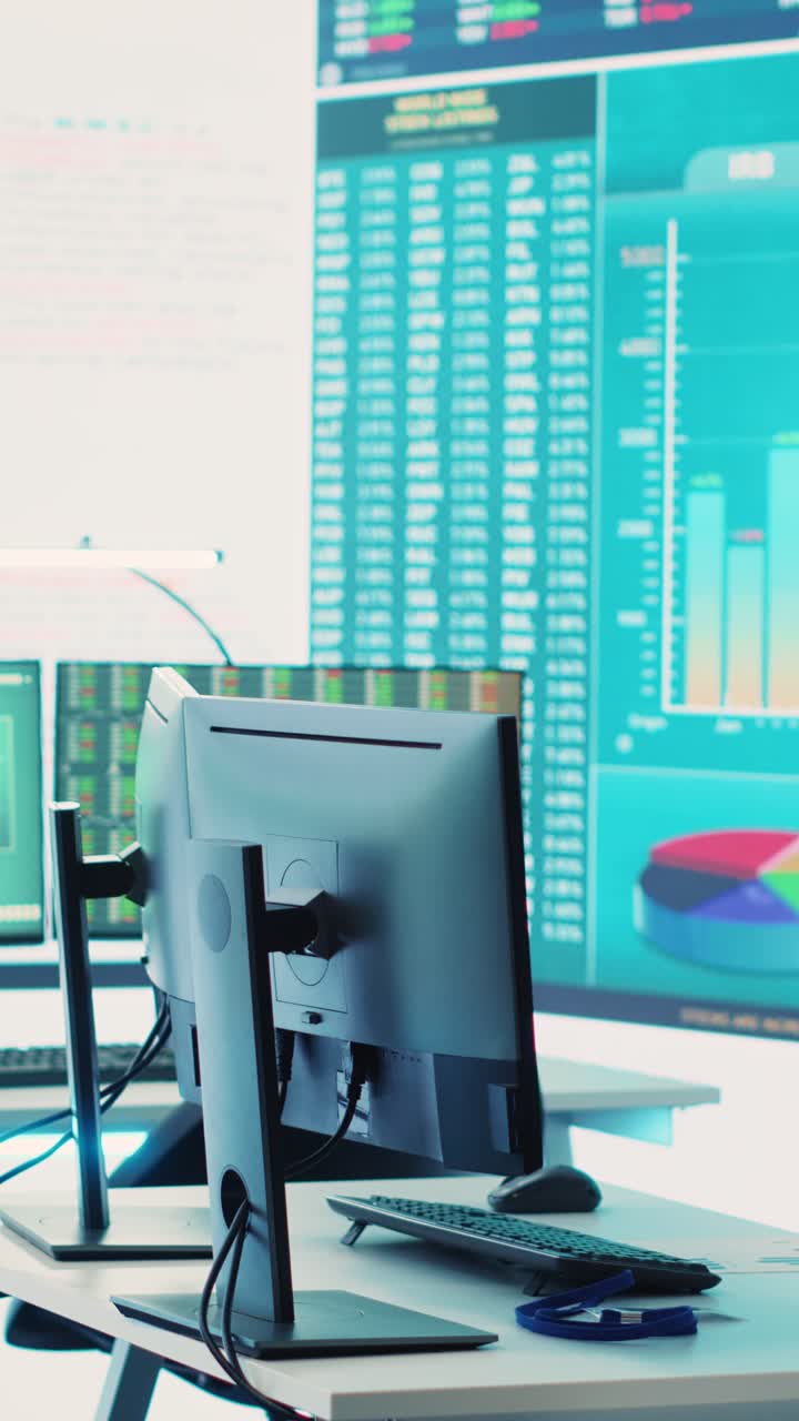 Empty Office Desk with Computer and Financial Data Displays