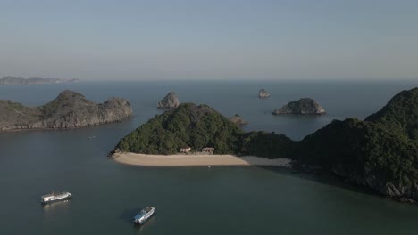 tour boats and fishing boats share mooring in ha long bay, vietnam