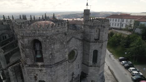 flying over a gothic facade of guarda cathedral in portugal