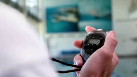 Cropped-video-of-trainer-using-stopwatch