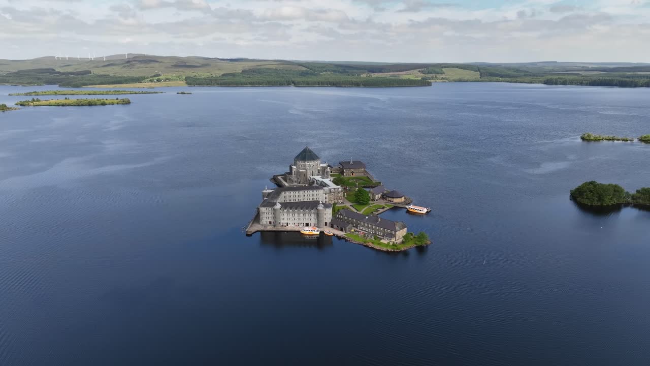 Lough Derg, County Donegal, Ireland, June 2023. Drone slow orbit clockwise above St. Patrick's Purgatory on Station Island on a beautiful sunny day.