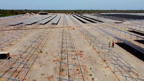 drone flyover dusty solar cells at a photovoltaic energy plant project in africa