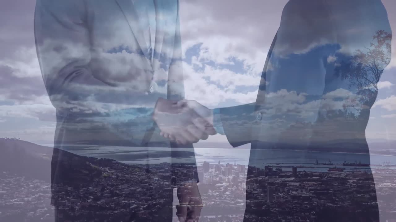 animación de un hombre de negocios apretando la mano sobre el paisaje