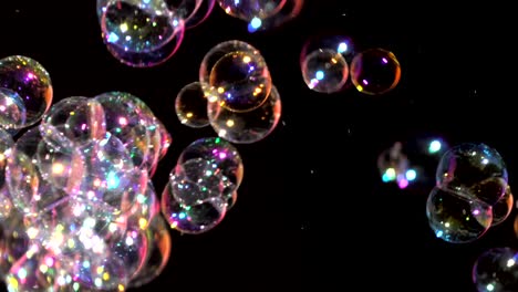 closeup of bubbles blowing on a black background