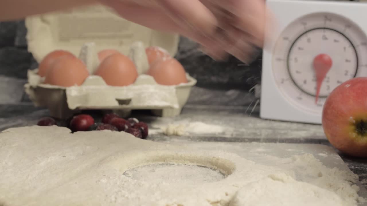 Hands cutting cooking dough with a cup medium shot