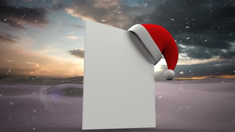 Animation-of-blank-card-with-copy-space-and-santa-hat-over-snow-falling-and-winter-scenery