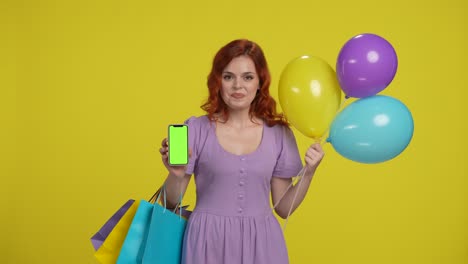 woman with balloons and shopping bags