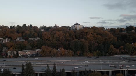 Aerial-static-shot-of-Saint-Mark's-Episcopal-Cathedral-with-a-busy-highway