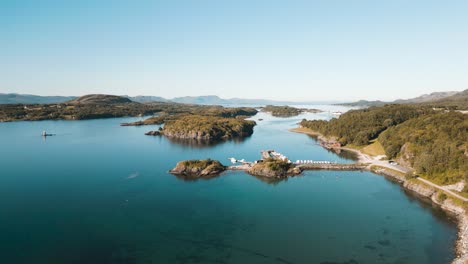 Fjord-landscape-with-island-on-fjord-waters,-shot-under-bright-summer-light-at-Leka-island,-Norway