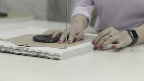 woman working on a sewing pattern