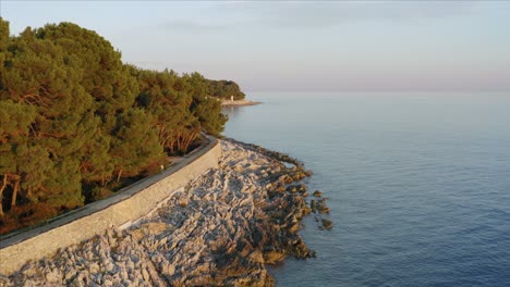 afternoon aerial dolly shot following the coastline of losinj island, croatia