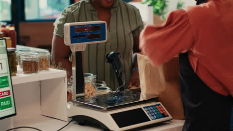 african american customer preparing to buy organic produce