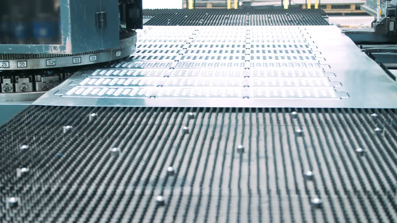 Punching machine punching sheet of iron making holes of certain size