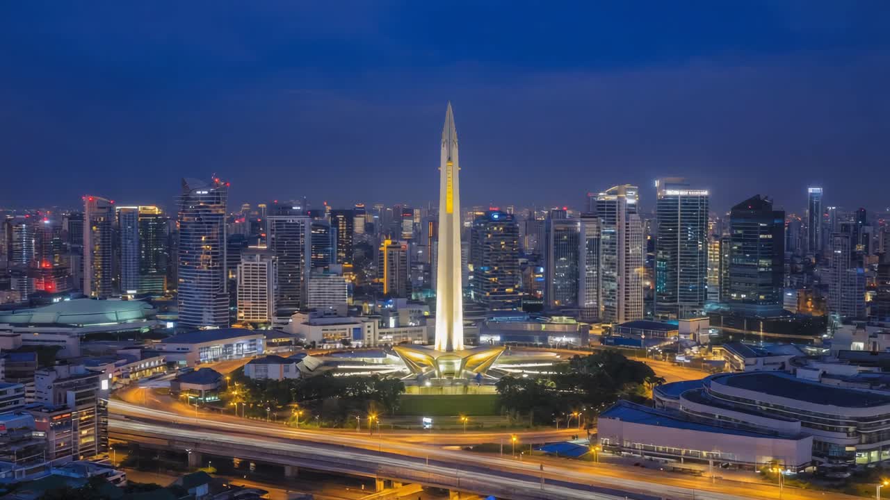 Night view of Bangkok skyline with monument