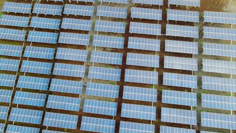 aerial of solar panel farm in rural africa