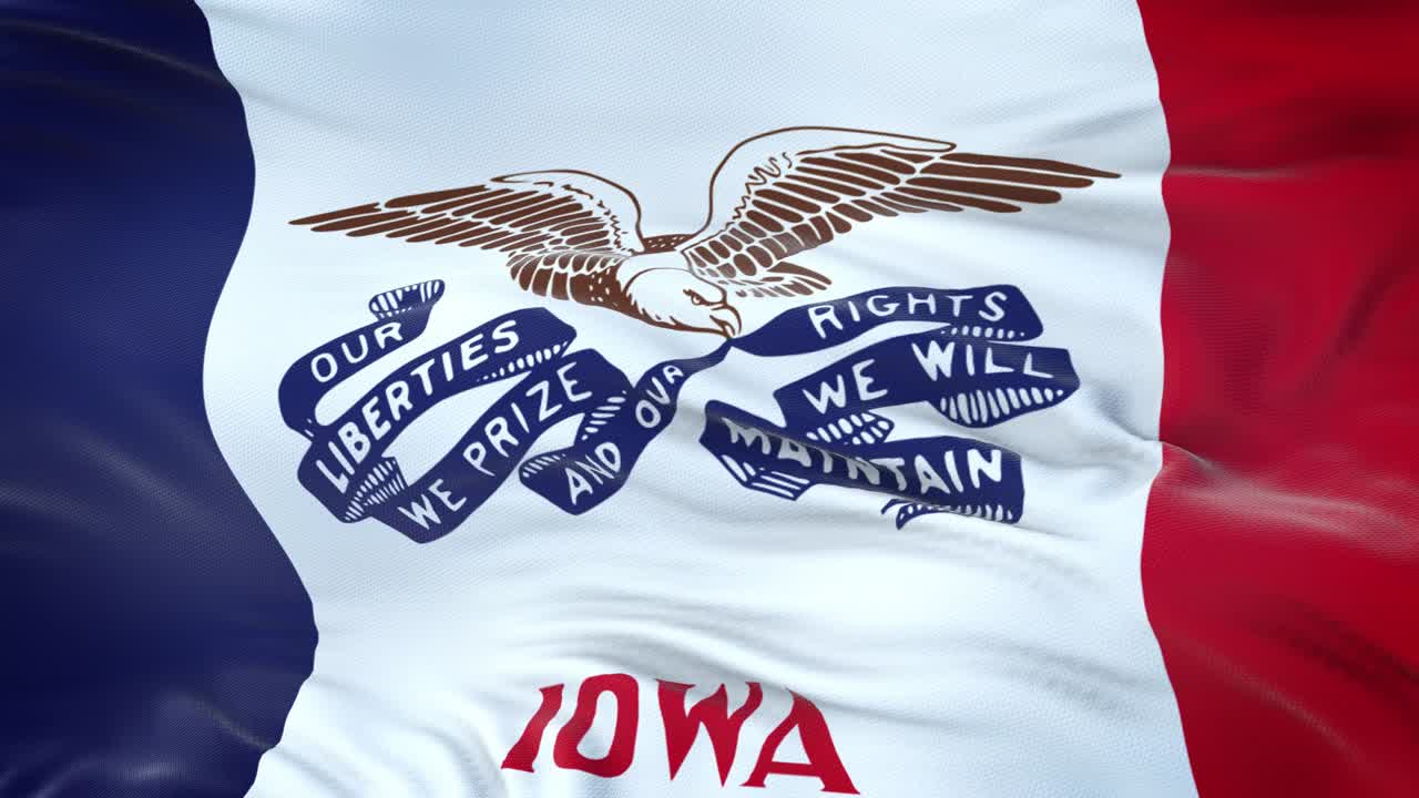 bandera de iowa (estado de los estados unidos) ondeando en el viento con una textura de tela muy detallada. bucle sin costuras