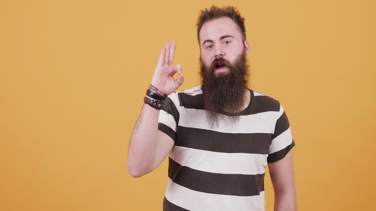 Man with beard making gestures