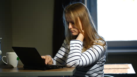 woman working with laptop at home