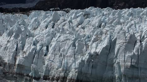 unique shapes of the jagged ice on top of margerie glacier, alaska